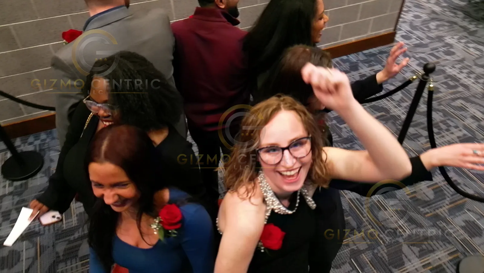 Guests interacting with a GlamAyre 360DroneBot from overhead